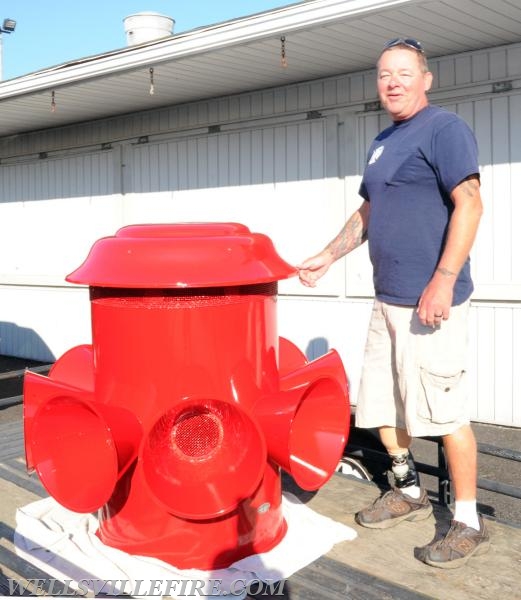 Re-conditioned siren placed back on pole, 07/20/16.  photos by Curt Werner
