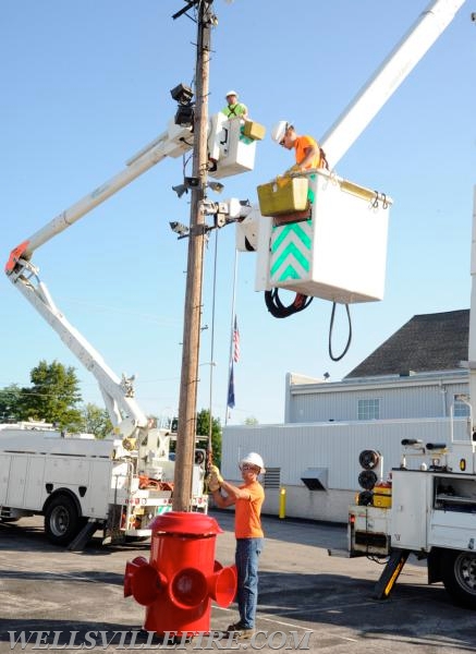 Re-conditioned siren placed back on pole, 07/20/16.  photos by Curt Werner