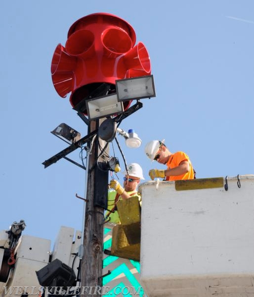 Re-conditioned siren placed back on pole, 07/20/16.  photos by Curt Werner
