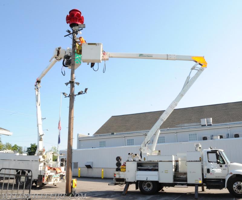 Re-conditioned siren placed back on pole, 07/20/16.  photos by Curt Werner